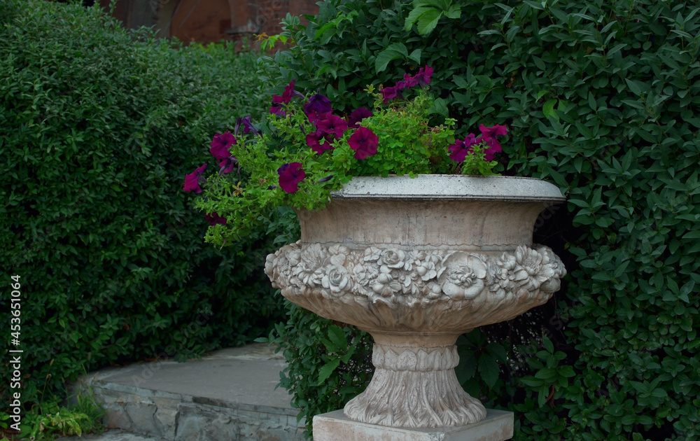 old dirty decorative flower vase in the garden