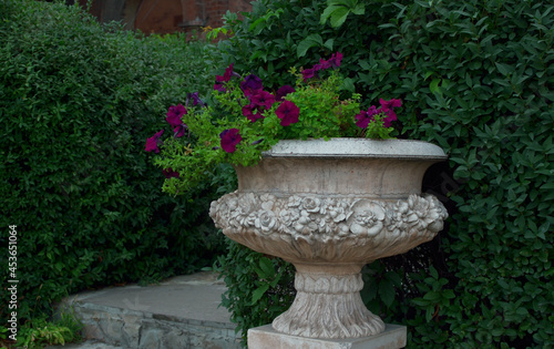 old dirty decorative flower vase in the garden