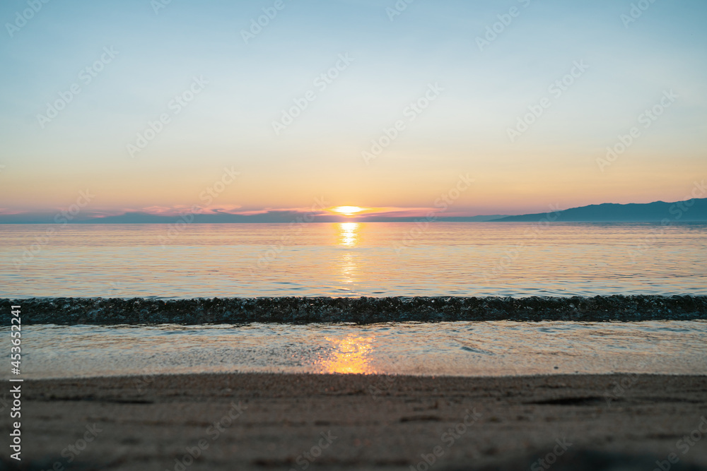 Picturesque view of Lake Baikal in sunrise .Rift lake located in southern Siberia, Russia. The largest freshwater lake by volume in the world. A Natural Wonder Of The World.