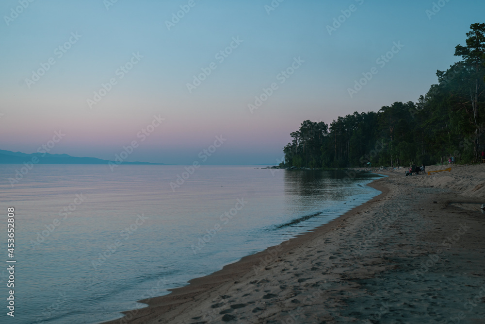 Fototapeta premium Picturesque view of Lake Baikal in sunrise .Rift lake located in southern Siberia, Russia. The largest freshwater lake by volume in the world. A Natural Wonder Of The World.