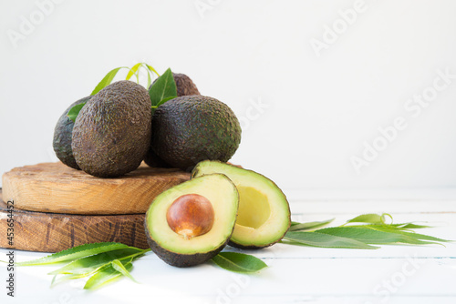 Haas avocado on a wooden board, natural products, selective focus