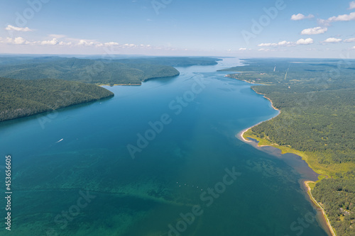 The Angara River is a major river in Siberia leaving Lake Baikal near the settlement of Listvyanka. Panoramic aerial view.