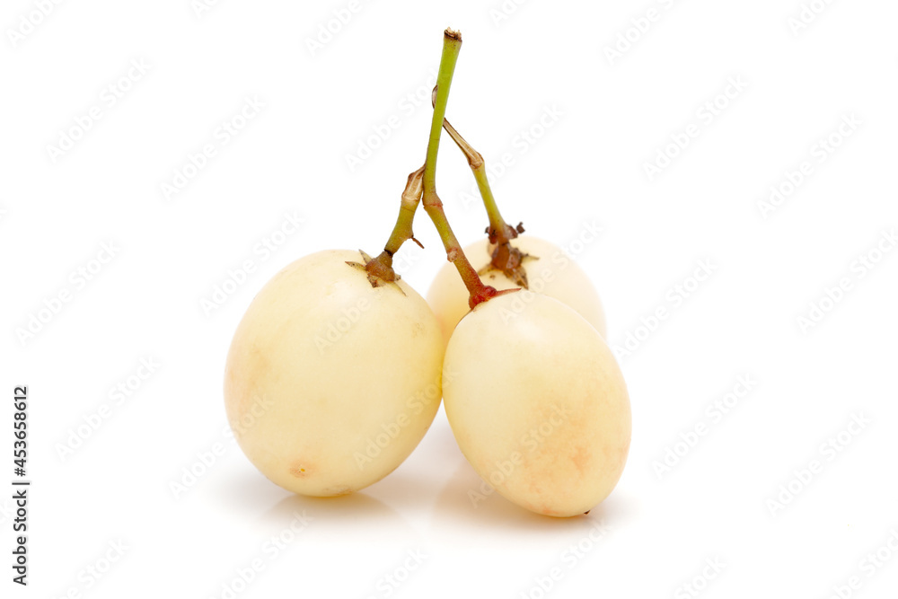Micro close-up and details of Organic white Indian karonda (Carissa carandas) carandas plum and karanda isolated over white background Micro close-up and details of Organic white Indian karonda (Carissa carandas) carandas plum and karanda isolated over white background