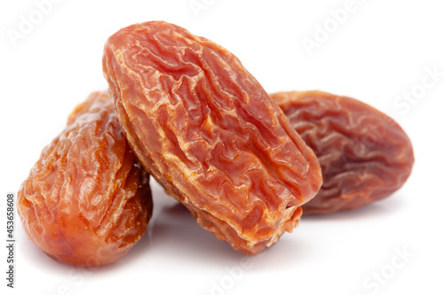 Micro close-up and details of Organic dried date or chhuhara (Phoenix dactylifera)  isolated over white background.
