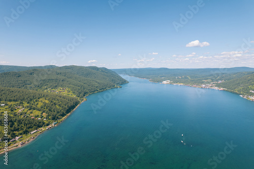 The Angara River is a major river in Siberia leaving Lake Baikal near the settlement of Listvyanka. Panoramic aerial view.