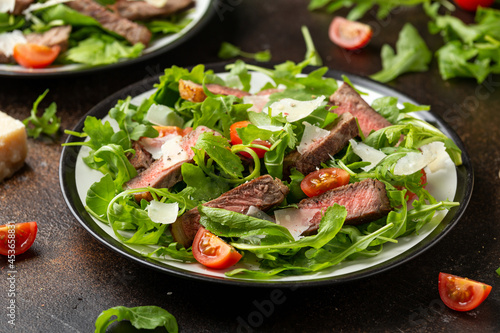 Italian Beef Tagliata salad with wild rocket, cherry tomatoes and parmesan cheese