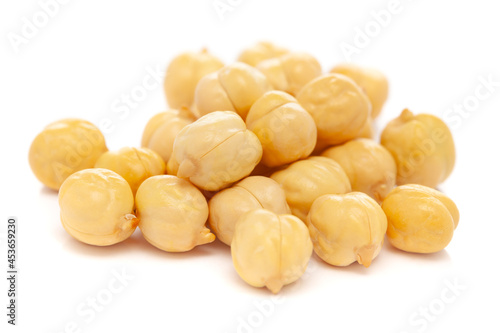 Micro close-up and details of Organic Indian roasted  chana or chickpea (Cicer arietinum) cleaned without flack or outer shell isolated over white background.
