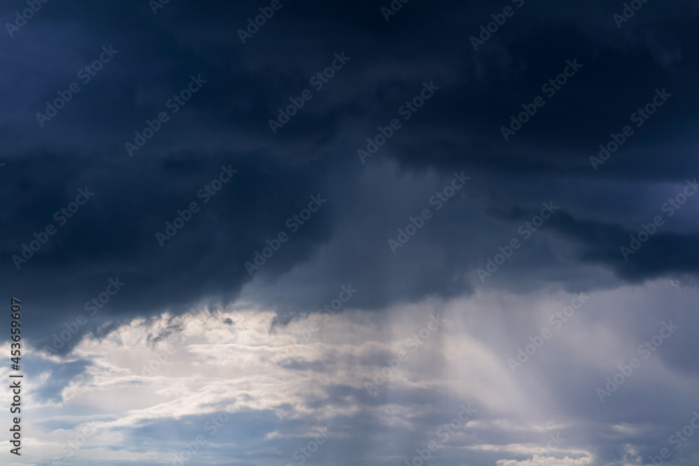 Obraz premium Dramatic storm cumulus cloud sky with rain