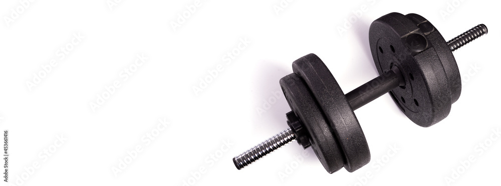 One big black dumbbell on white background with place for text One big black dumbbell on white background with place for text