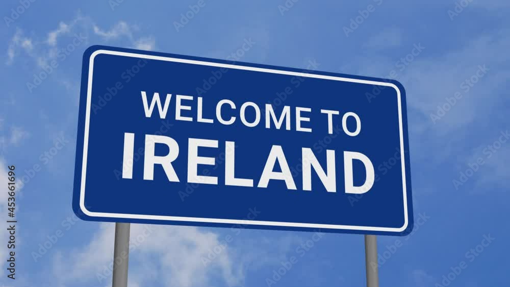 Welcome to Ireland Road Sign on Clear Blue Sky with Rapid Moving Clouds Welcome to Ireland Road Sign on Clear Blue Sky with Rapid Moving Clouds