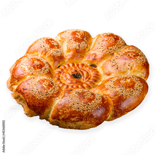 Uzbek bread from tandoor with raisin side view, isolated on white background