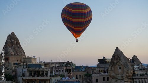 Hot air balloons launch in the Goreme national park in Cappadocia, Turkey. Colorful balon flying over. Cappadocia's greatest tourist attraction is ballooning. 
