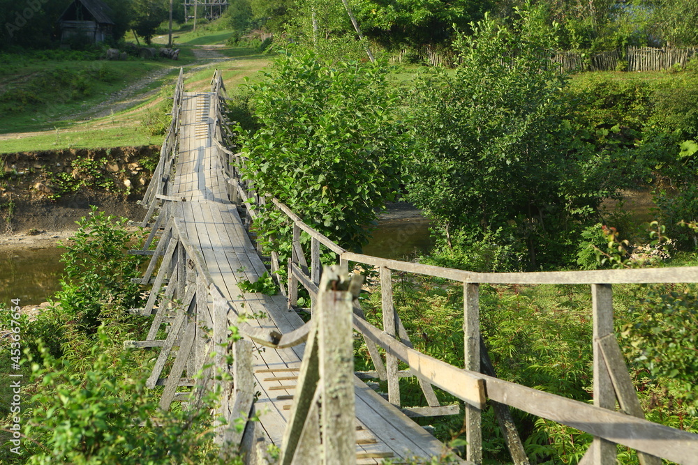 Wooden bridge over the river Wooden bridge over the river