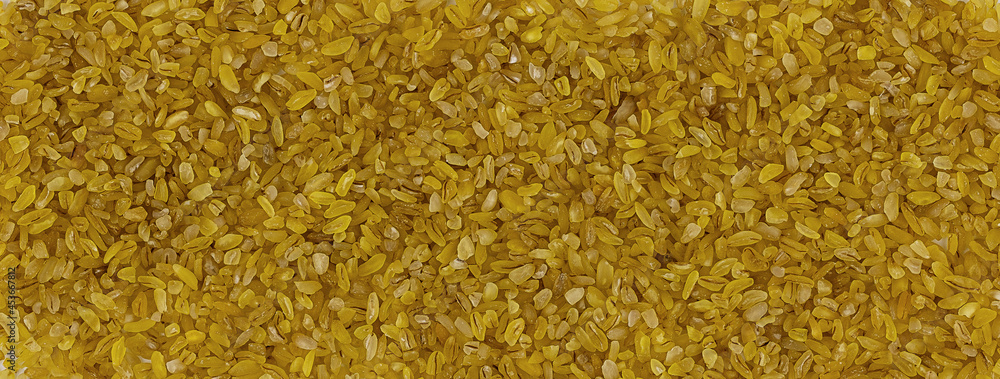 bulgur texture banner. uncooked bulgur as background. close-up of bulgur top view bulgur texture banner. uncooked bulgur as background. close-up of bulgur top view
