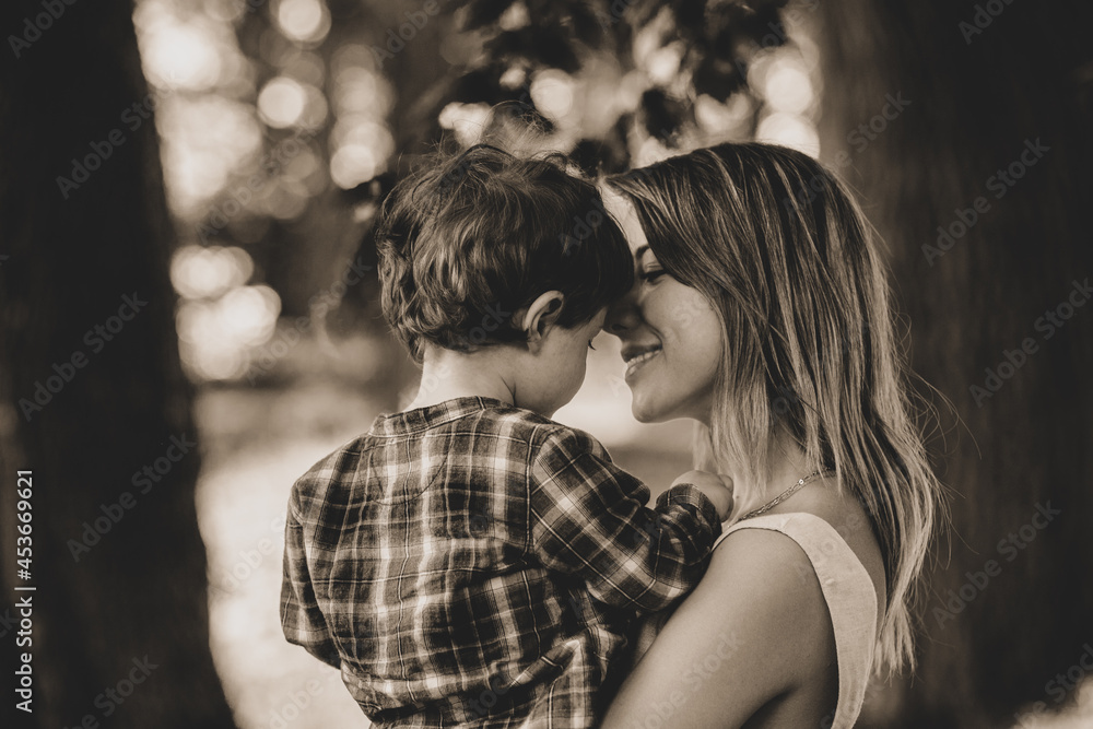 mother holds son on a hands at outdoor mother holds son on a hands at outdoor