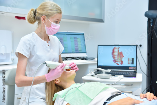 Orthodontist scaning patient with dental intraoral scanner