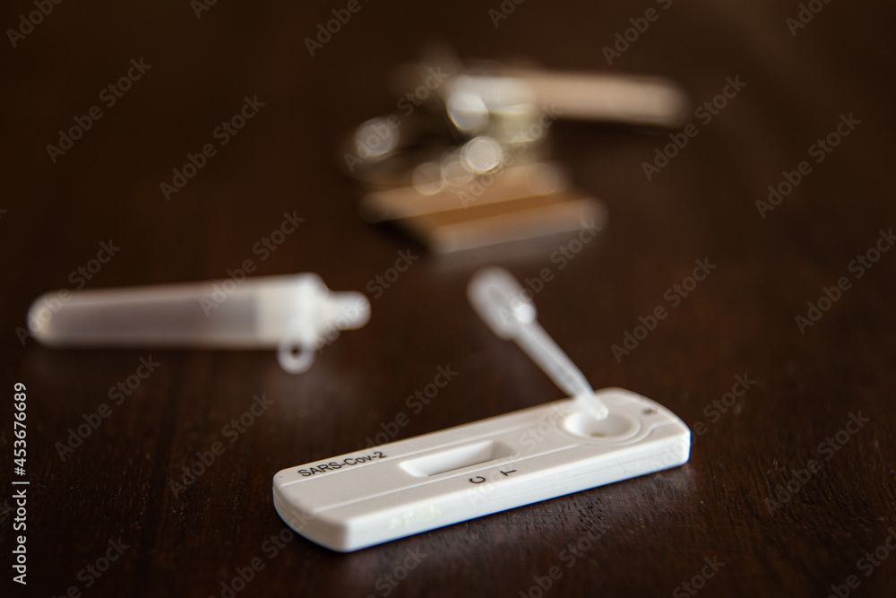 SARS Cov-2 antigen test kit on a wooden table SARS Cov-2 antigen test kit on a wooden table