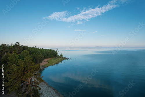 Summertime imagery of Lake Baikal in morning is a rift lake located in southern Siberia, Russia. Baikal lake summer landscape view. Drone's Eye View.