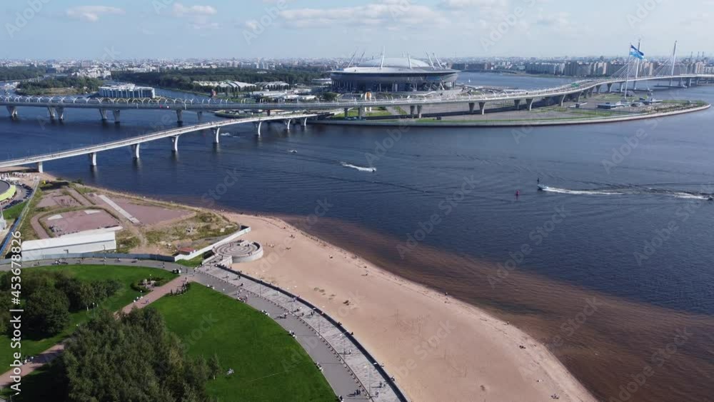 Gazprom Arena (Krestovsky Stadium) and the beach of the Gulf of Finland near the park of the 300th anniversary of Saint Petersburg Gazprom Arena (Krestovsky Stadium) and the beach of the Gulf of Finland near the park of the 300th anniversary of Saint Petersburg