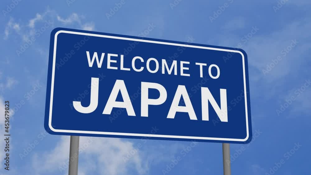 Welcome to Japan Road Sign on Clear Blue Sky with Rapid Moving Clouds Welcome to Japan Road Sign on Clear Blue Sky with Rapid Moving Clouds