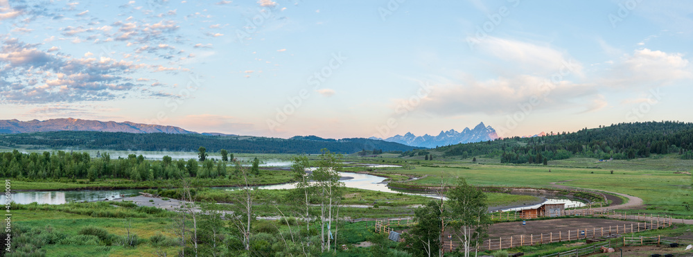Panorama of Buffalo Fork River Valley in Morning Light with Mist on the River and the Grand Teton Mountains in the Background