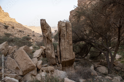 A naturally splitted rock in the Sha'ib Luha Valley near Riyadh, Saudi Arabia photo