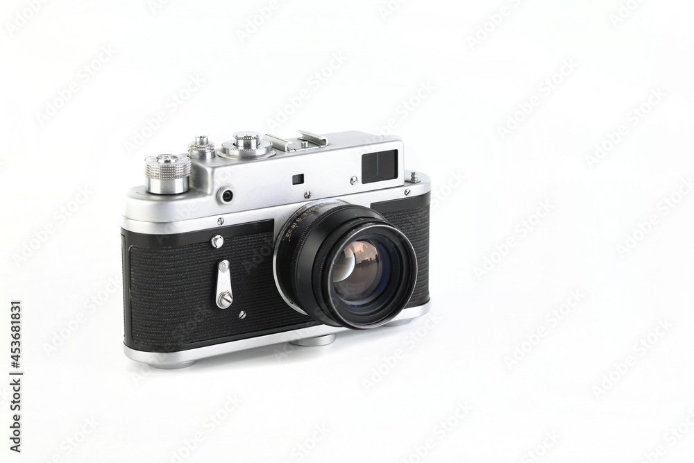 Old rangefinder film photo camera on white background.