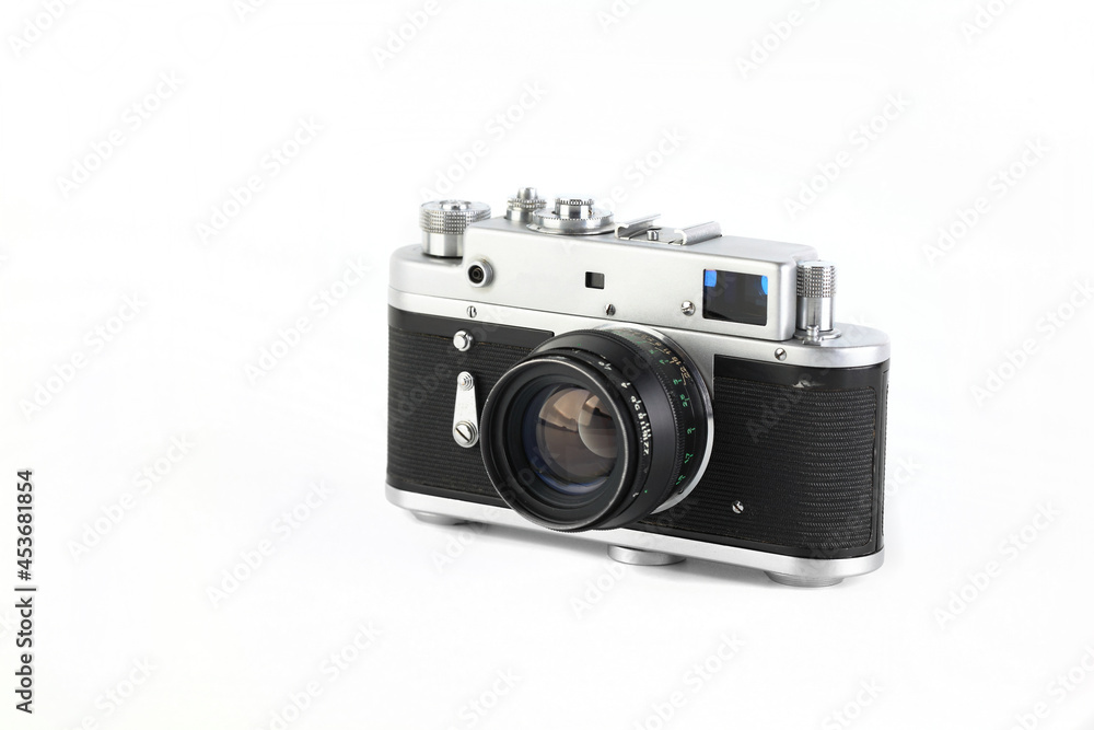 Old rangefinder film photo camera on white background.