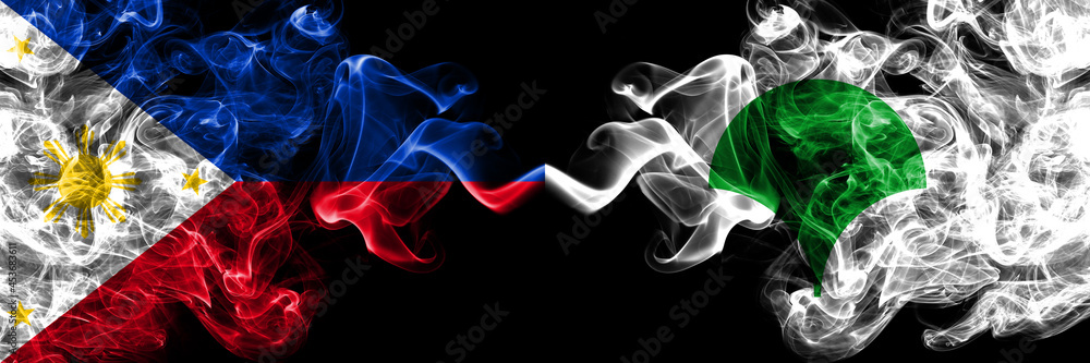Philippines, Filipino vs Japan, Japanese, Tokyo smoke flags side by side. Philippines, Filipino vs Japan, Japanese, Tokyo smoke flags side by side.