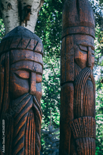 wooden pillars in the form of a head 