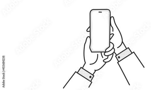 Businessman holds mobile phone in hands.