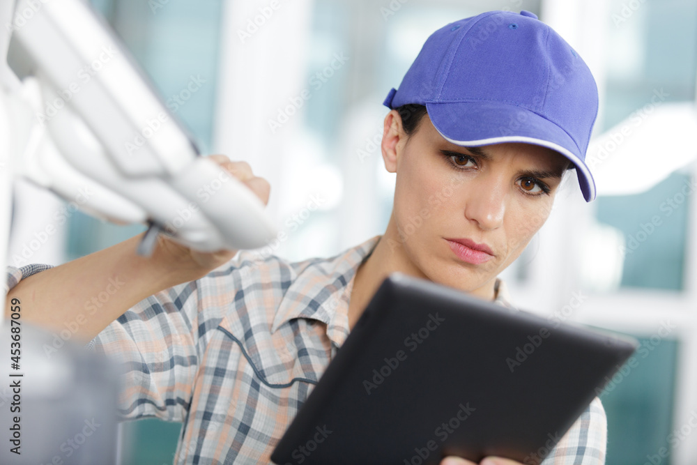 female technician using tablet control female technician using tablet control