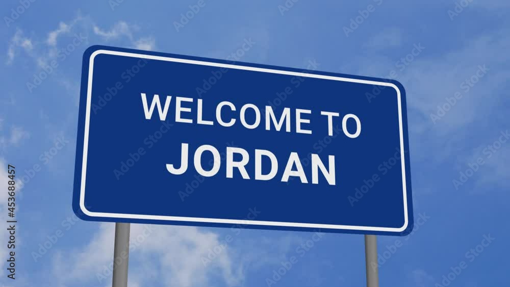 Welcome to Jordan Road Sign on Clear Blue Sky with Rapid Moving Clouds Welcome to Jordan Road Sign on Clear Blue Sky with Rapid Moving Clouds