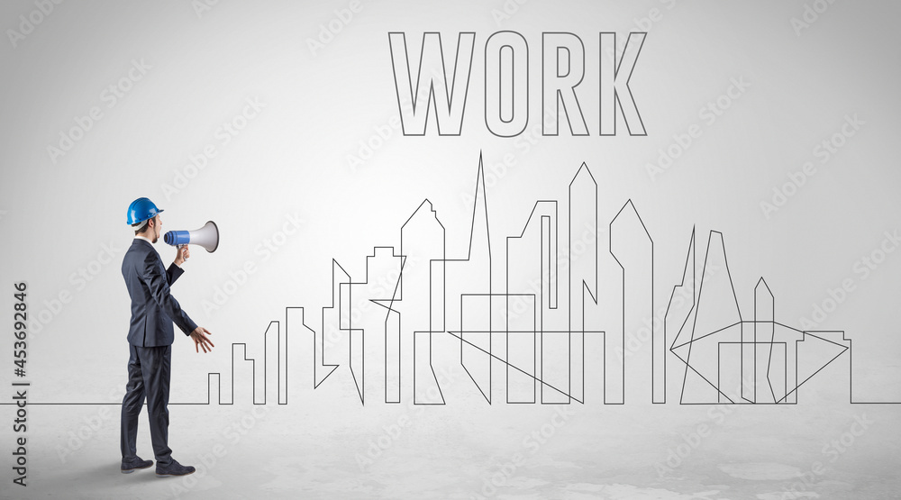 Businessman in hard hat holding blueprint Businessman in hard hat holding blueprint