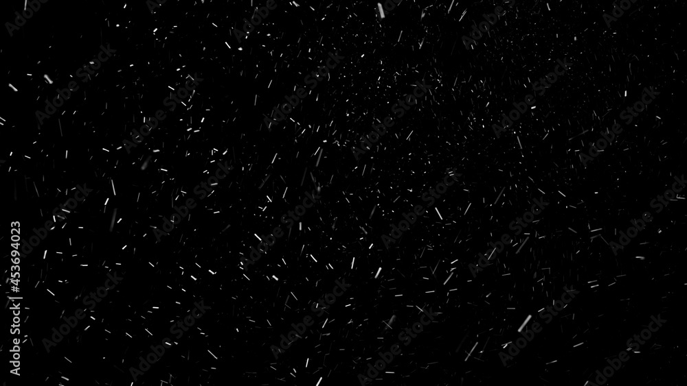Heavy snowfall on the black background. Strong wind forcing big snowflakes to fall at high speed in different directions.