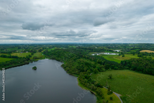 Landscape of hills covered in greenery surrounded by Lough Eske in Donegal, Ireland photo