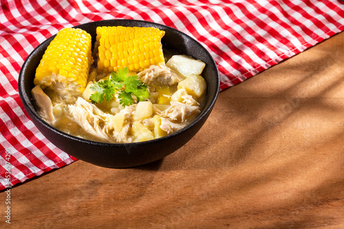 Colombian cuisine - ajiaco soup with chicken and vegetables photo