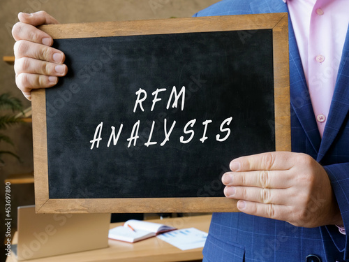 Business concept about RFM ANALYSIS Recency Frequency Monetary with inscription on the chalkboard. photo