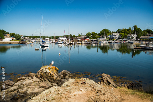 sailboats anchored in a bay of Maine coast fishing port photo