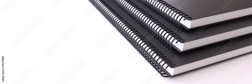 Closeup of three black notebooks on white background. Closeup of three black notebooks on white background.