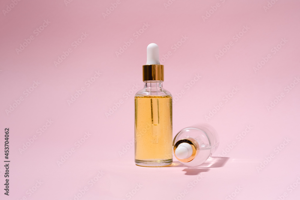 Dropper glass bottles with pipette. Transparent hyaluronic natural beauty product and eco serum skin care concept. Top horizontal view copyspace. Dropper glass bottles with pipette. Transparent hyaluronic natural beauty product and eco serum skin care concept. Top horizontal view copyspace.