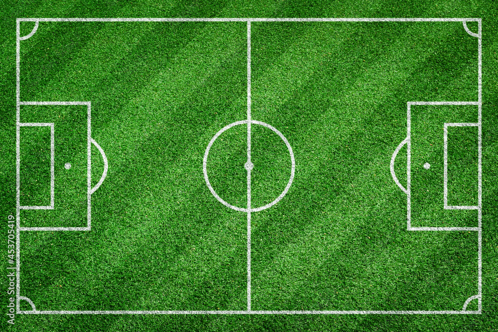 Green soccer, football field. Striped grass texture for sport background.