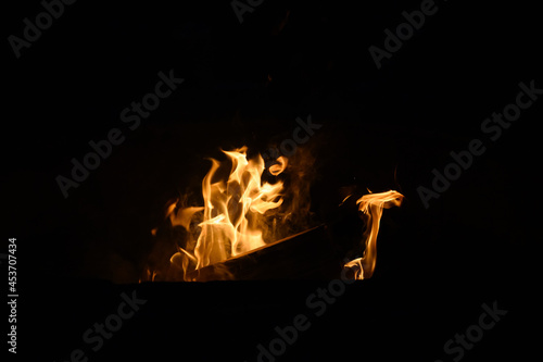 Flames of a campfire on a dark night  summer camp out  as a recreation background 