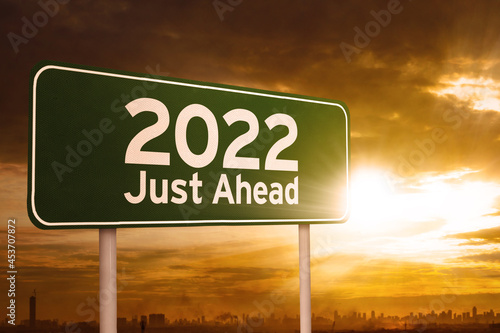Signboard with text of 2022 just ahead at sunrise