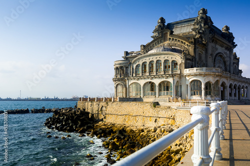 Symbol Constanta - abandoned casino on the sea shore, Romania photo