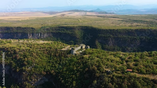 Aerial View Of Samshvilde Citadel Ruins On Steep Edge Of Promontory In Kvemo Kartli, Georgia. orbiting shot photo