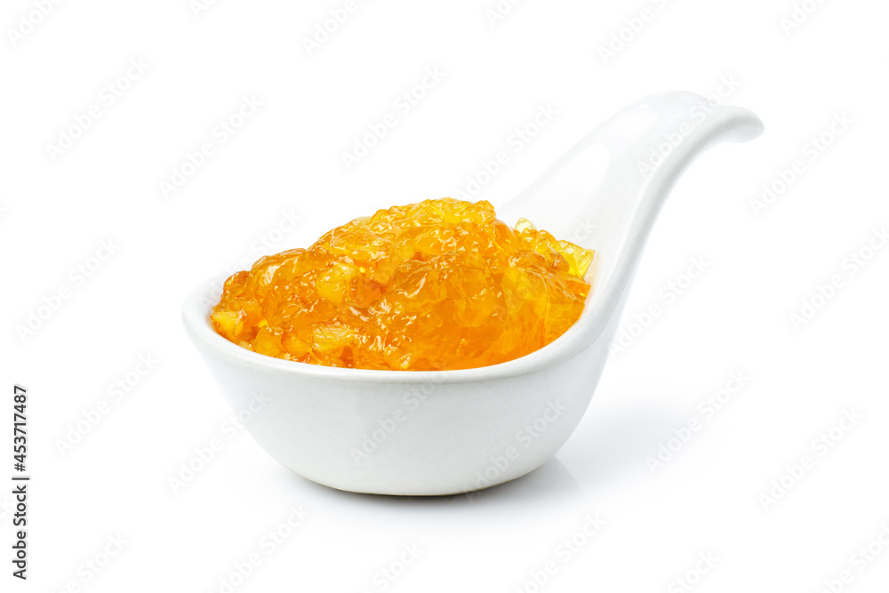 spoon with orange jam isolated on white spoon with orange jam isolated on white