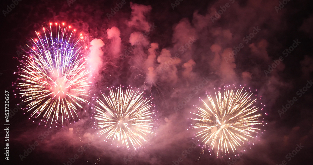 Firework celebrate anniversary happy new year 2022, 4th of july holiday festival. colorful firework in the night time to celebrate national holiday. countdown to new year 2022 party time event. Firework celebrate anniversary happy new year 2022, 4th of july holiday festival. colorful firework in the night time to celebrate national holiday. countdown to new year 2022 party time event.