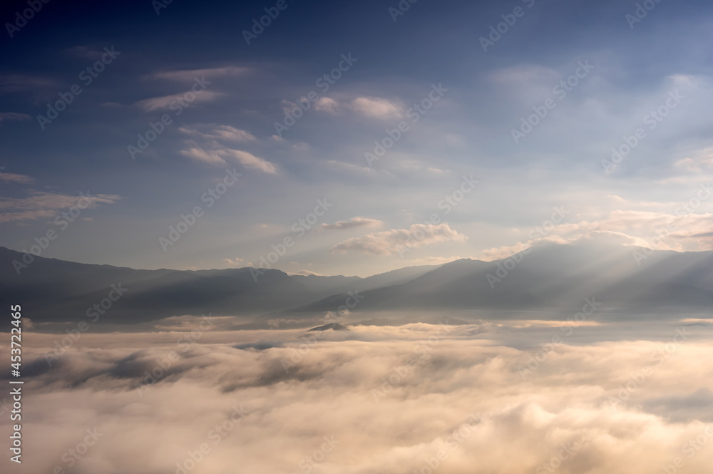 Fototapeta premium Aerial view Beautiful of morning scenery sea of cloud and the fog flows on high mountains.