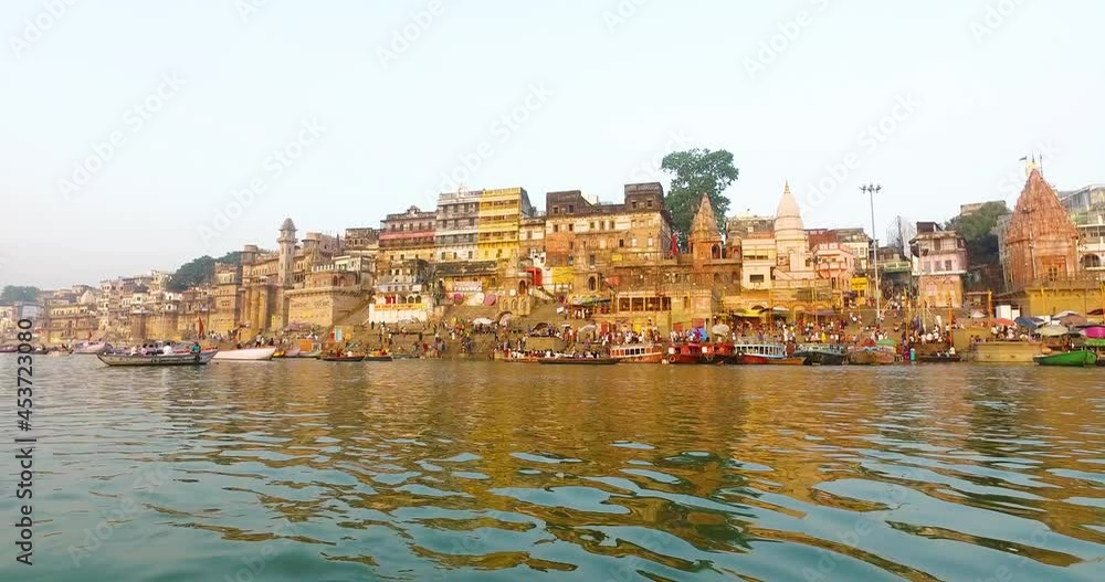 River Ganges in Varanasi with Buildings Lit in the Morning Sunrise in India. River Ganges in Varanasi with Buildings Lit in the Morning Sunrise in India.